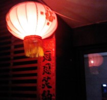 An electric lantern hanging outside my building.